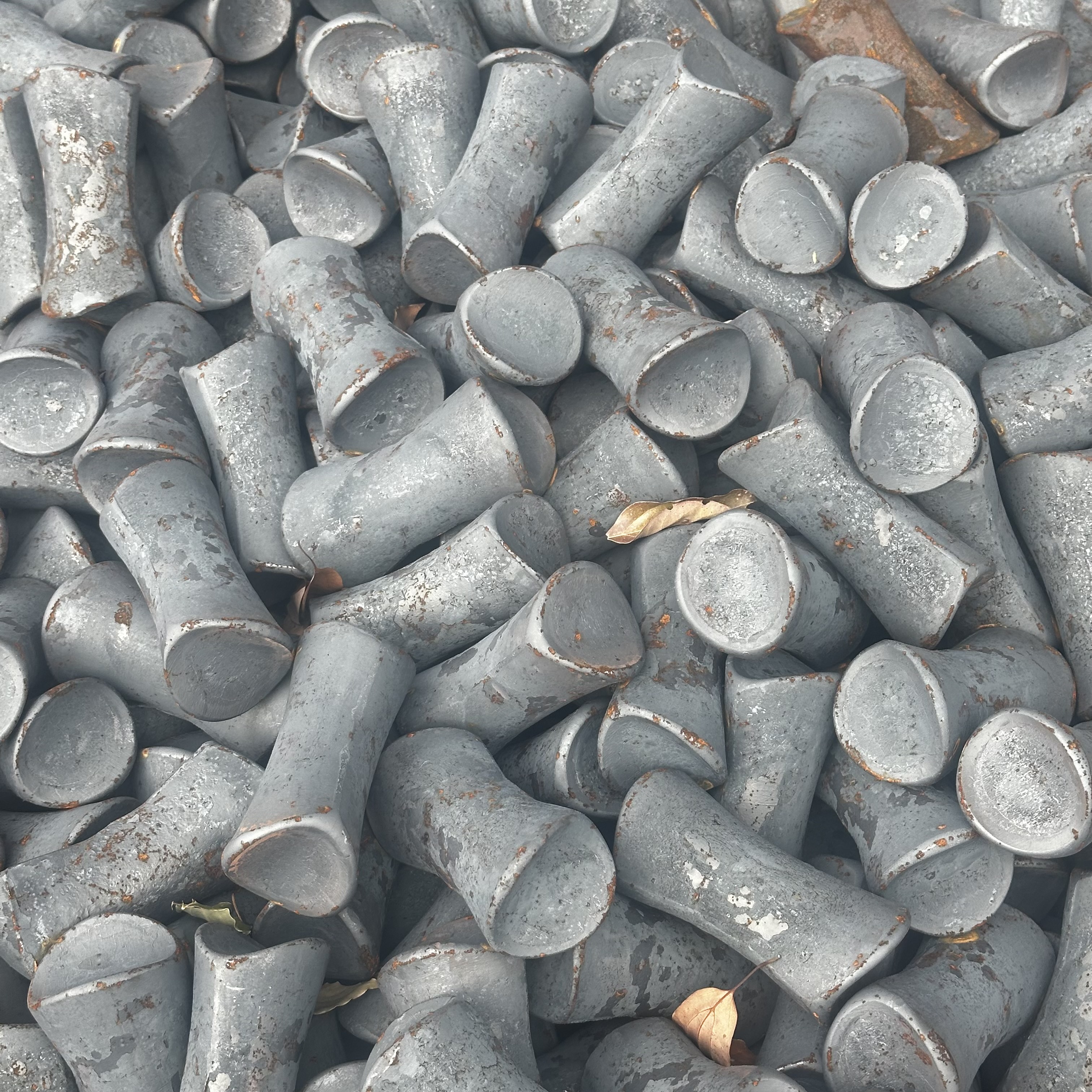 Modern manufacturing facility with automated production line showing workers in safety gear operating industrial machinery, clean factory floor with conveyor belts and quality control stations