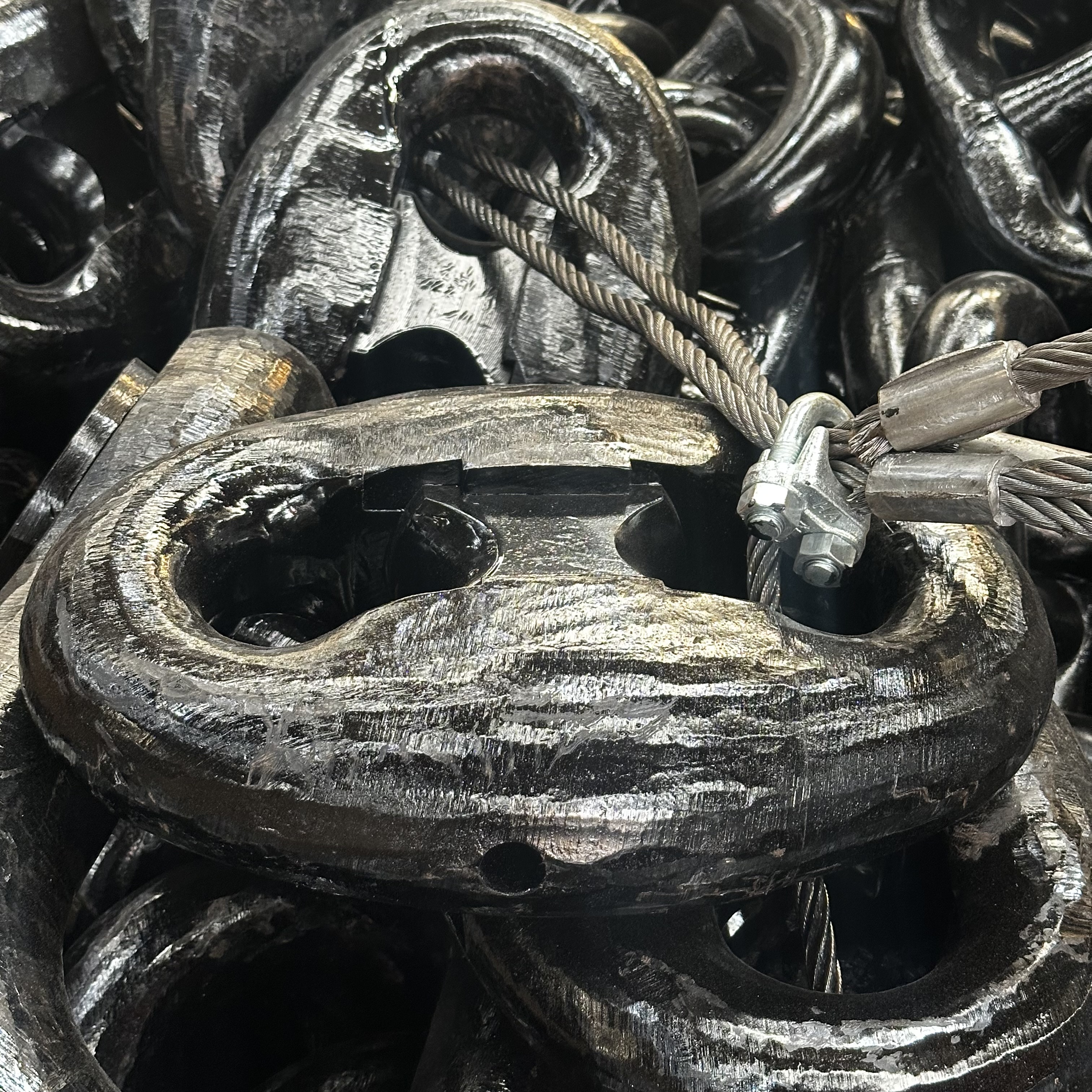 Modern manufacturing facility with automated production line showing workers in safety gear operating industrial machinery, clean factory floor with conveyor belts and quality control stations